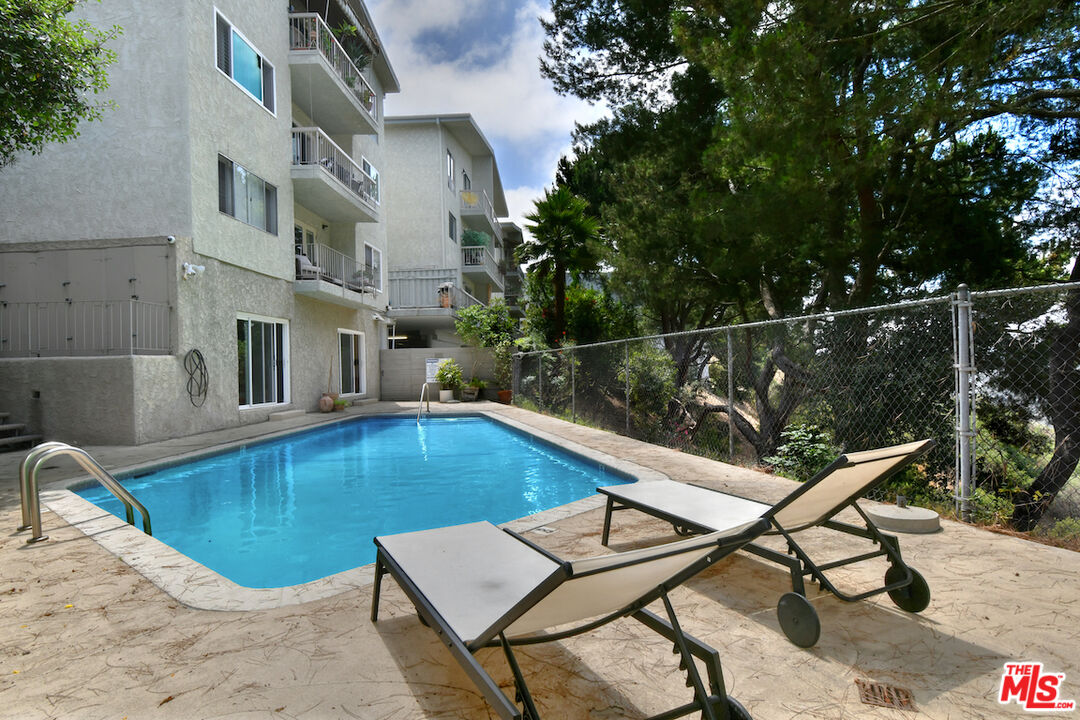 2345 Roscomare Road, Unit 205 Los Angeles, CA 90077 - Photo 42 of 50 a view of swimming pool with seating space