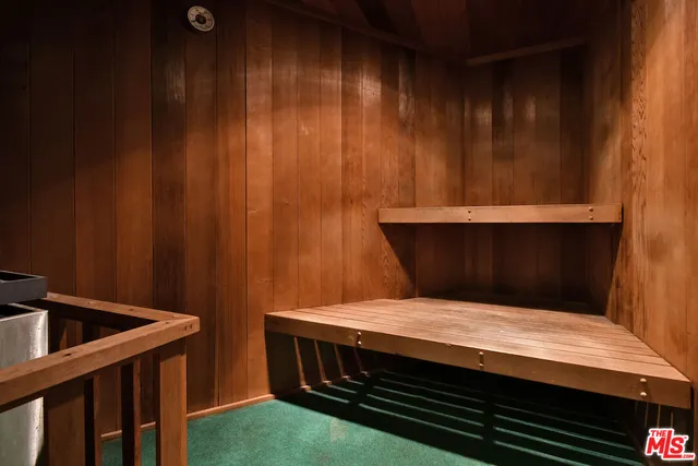 a bedroom with a bed and curtain