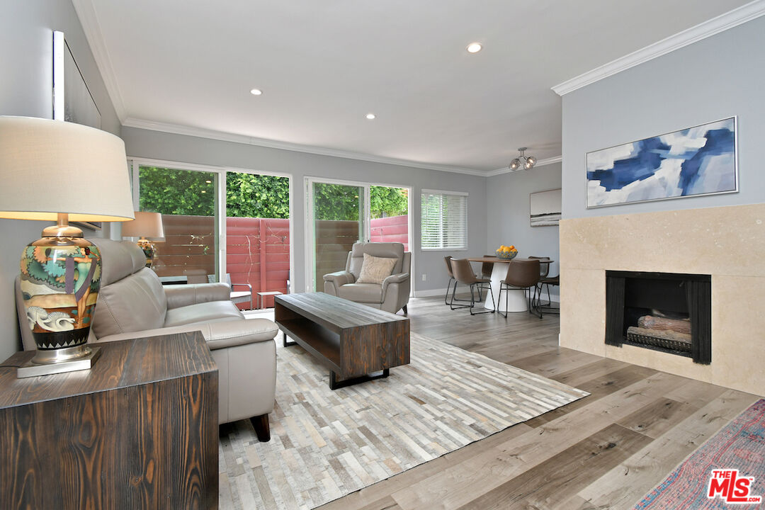 2345 Roscomare Road, Unit 205 Los Angeles, CA 90077 - Photo 7 of 50 a living room with furniture and a fireplace