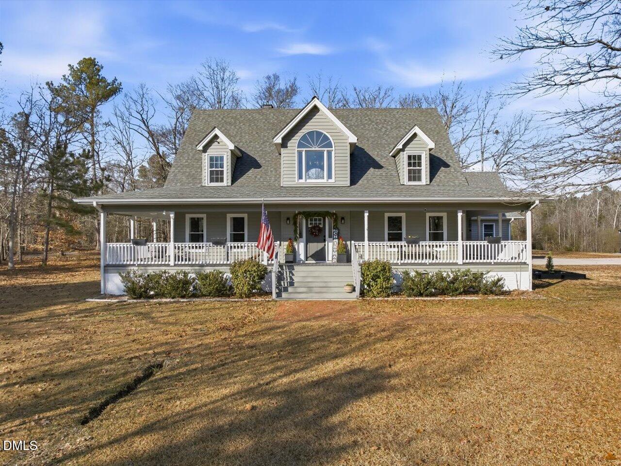 274 Powers Country Lane Bennett, NC 27208 - Photo 2 of 62 a front view of a house with a yard