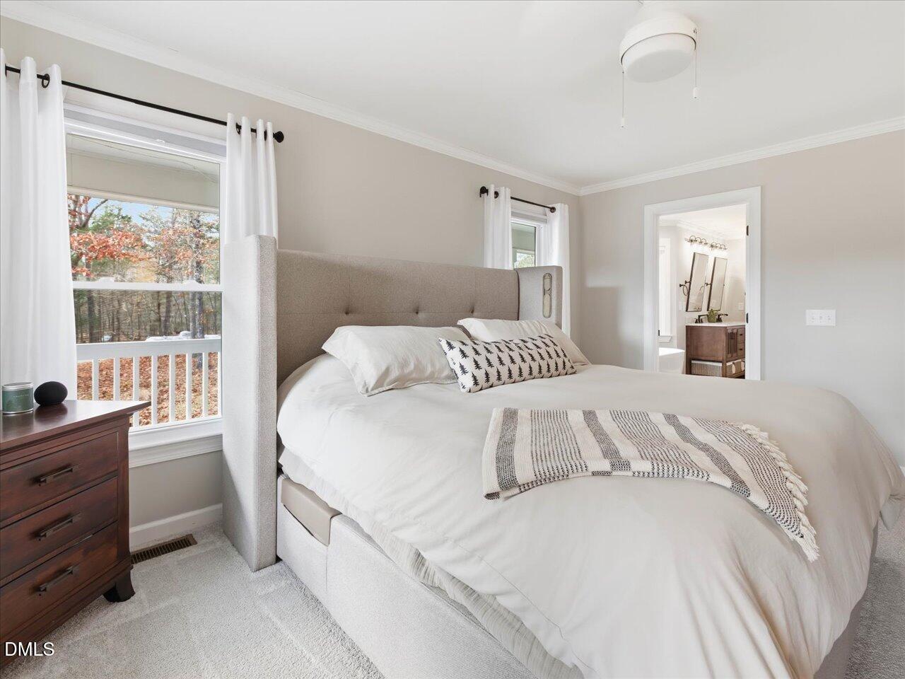 274 Powers Country Lane Bennett, NC 27208 - Photo 23 of 62 a bedroom with a bed and a window