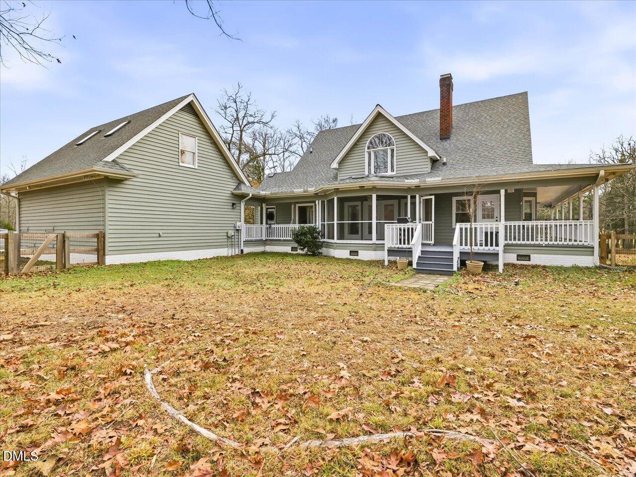 274 Powers Country Lane Bennett, NC 27208 - Photo 41 of 62 a front view of a house with a yard