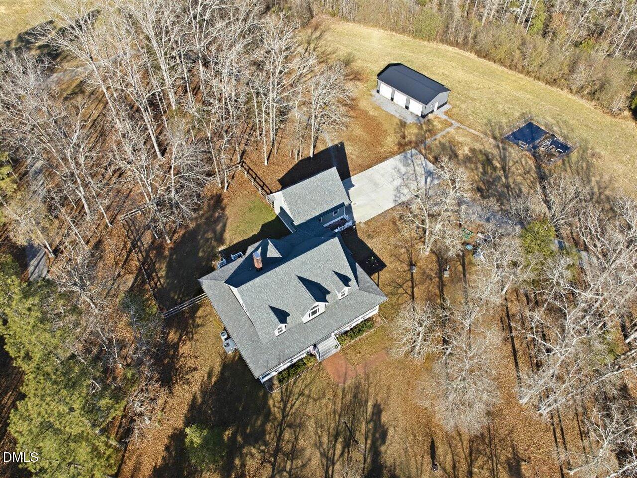 274 Powers Country Lane Bennett, NC 27208 - Photo 48 of 62 view of a house with a yard