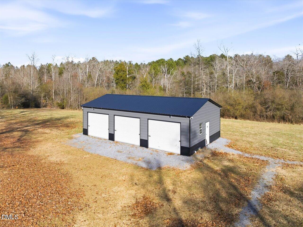 274 Powers Country Lane Bennett, NC 27208 - Photo 49 of 62 a view of a house with a yard and mountain view