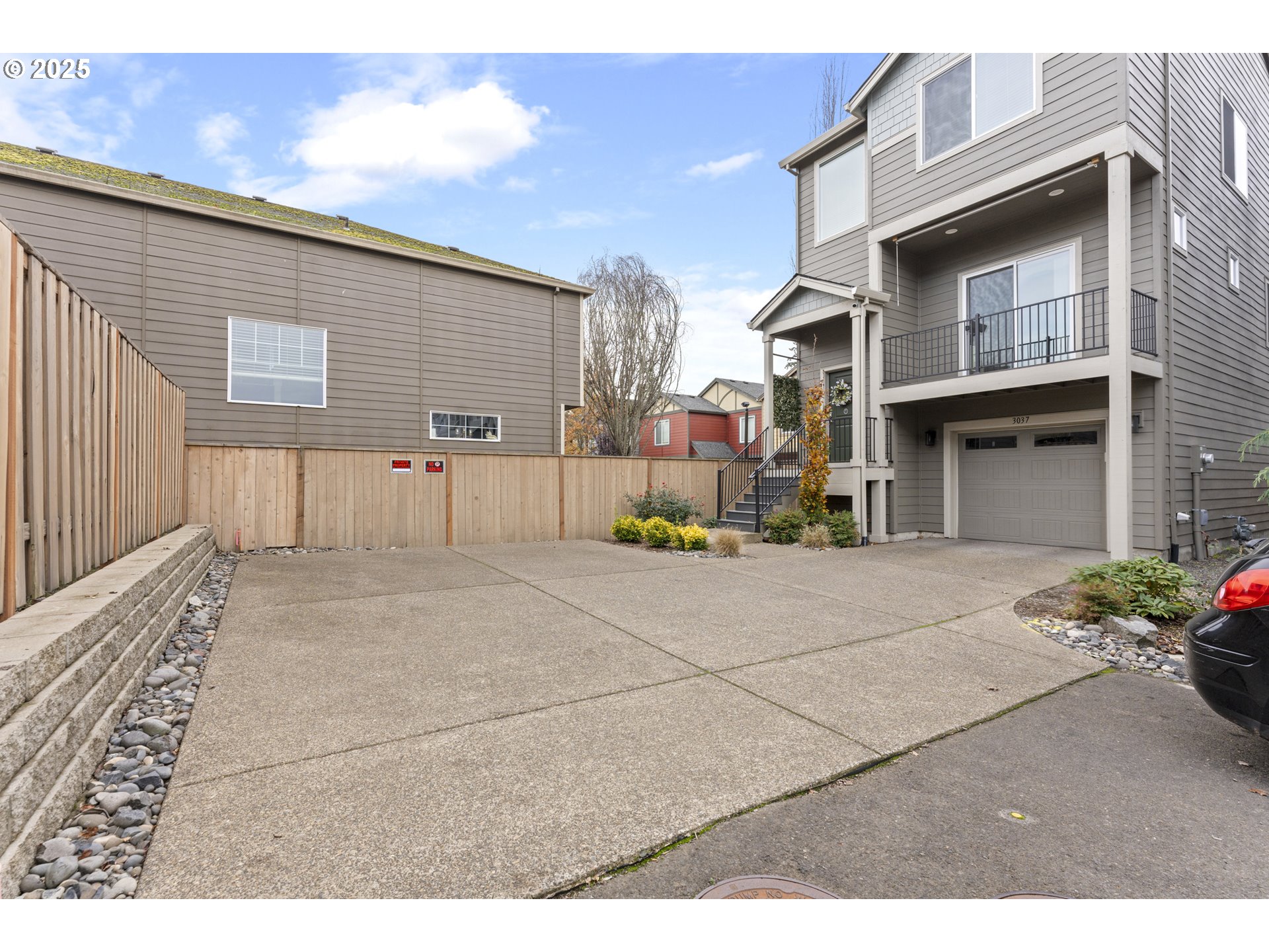 3037 Southwest Sherman Place Beaverton, OR 97003 - Photo 2 of 39 a view of a street with buildings
