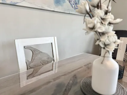 a bathroom with a sink mirror and vanity