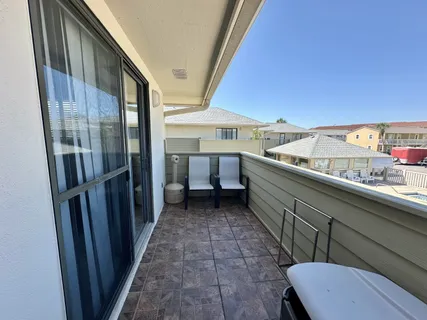 a view of a hallway with furniture