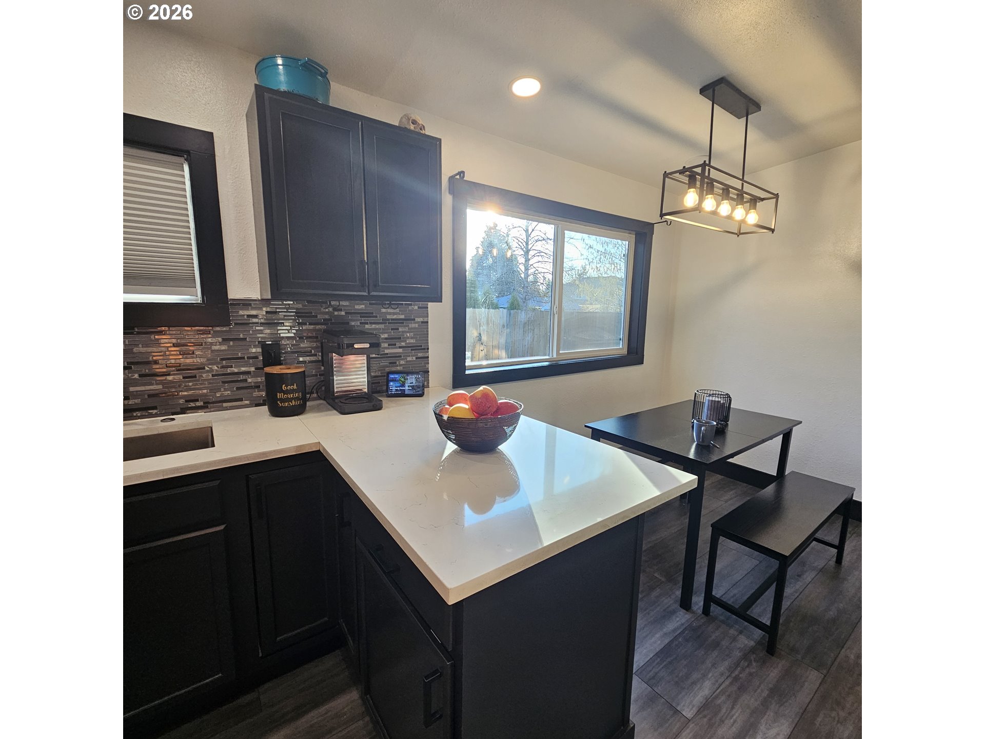 153 Southeast James Street Camas, WA 98607 - Photo 12 of 35 a kitchen with a sink cabinets and wooden floor
