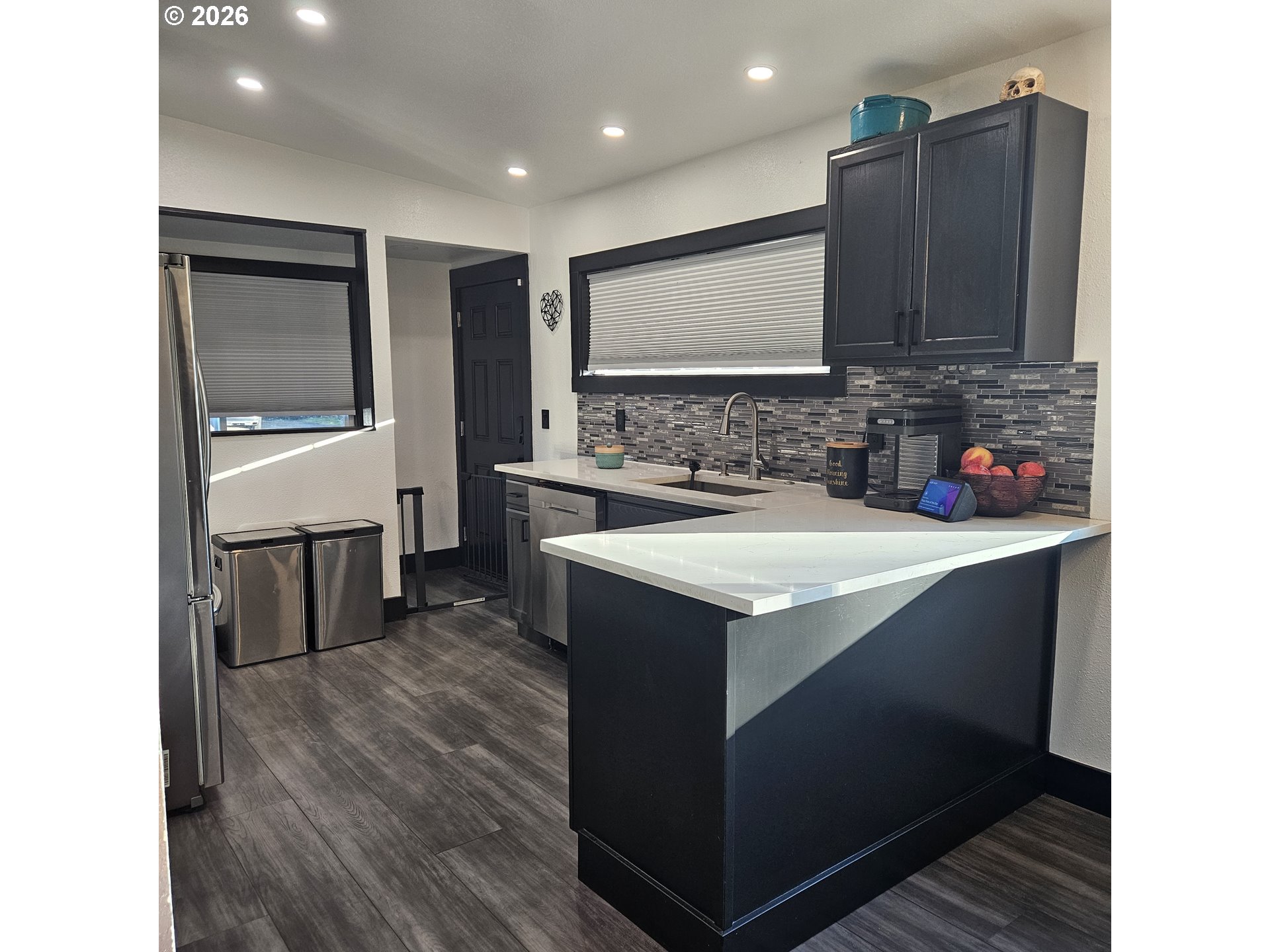 153 Southeast James Street Camas, WA 98607 - Photo 13 of 35 a kitchen with a sink cabinets and wooden floor