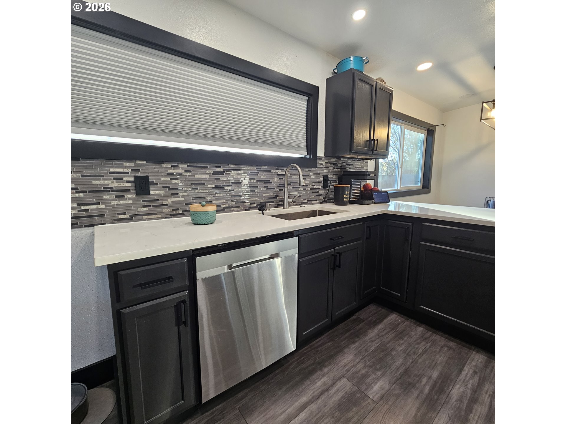 153 Southeast James Street Camas, WA 98607 - Photo 15 of 35 a kitchen with a sink and cabinets