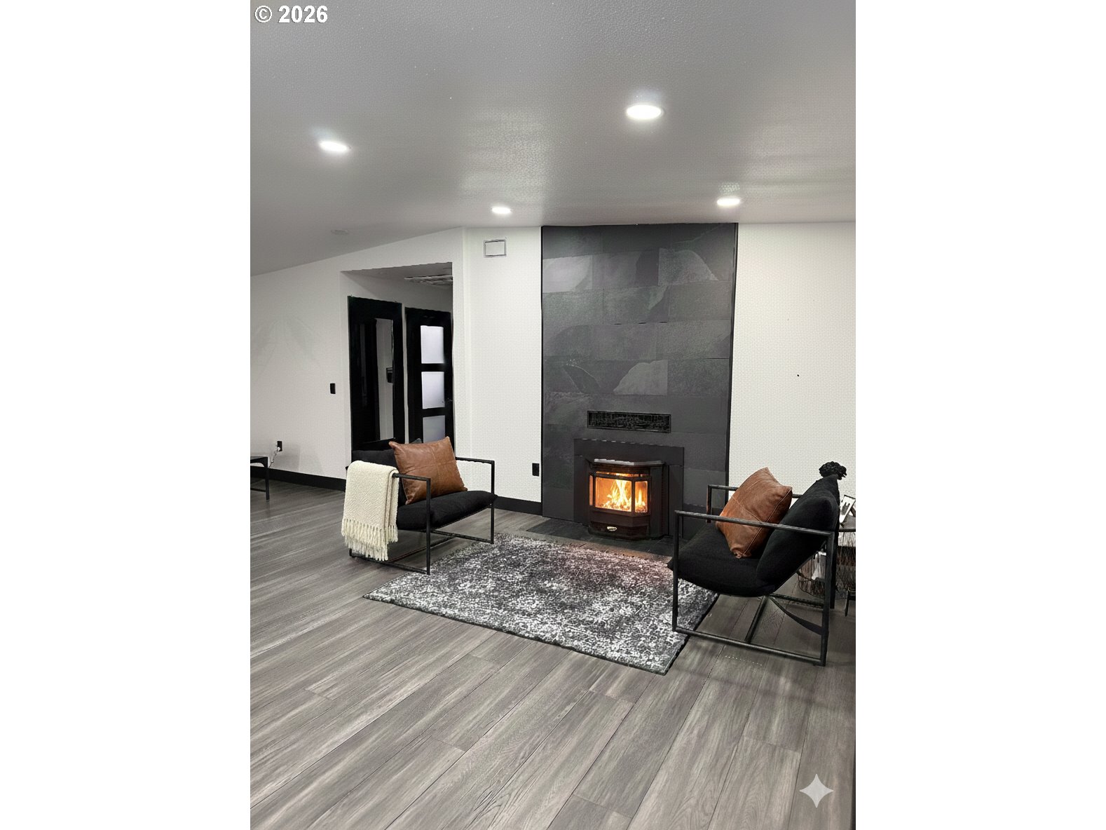 153 Southeast James Street Camas, WA 98607 - Photo 2 of 35 a living room with furniture and a fireplace