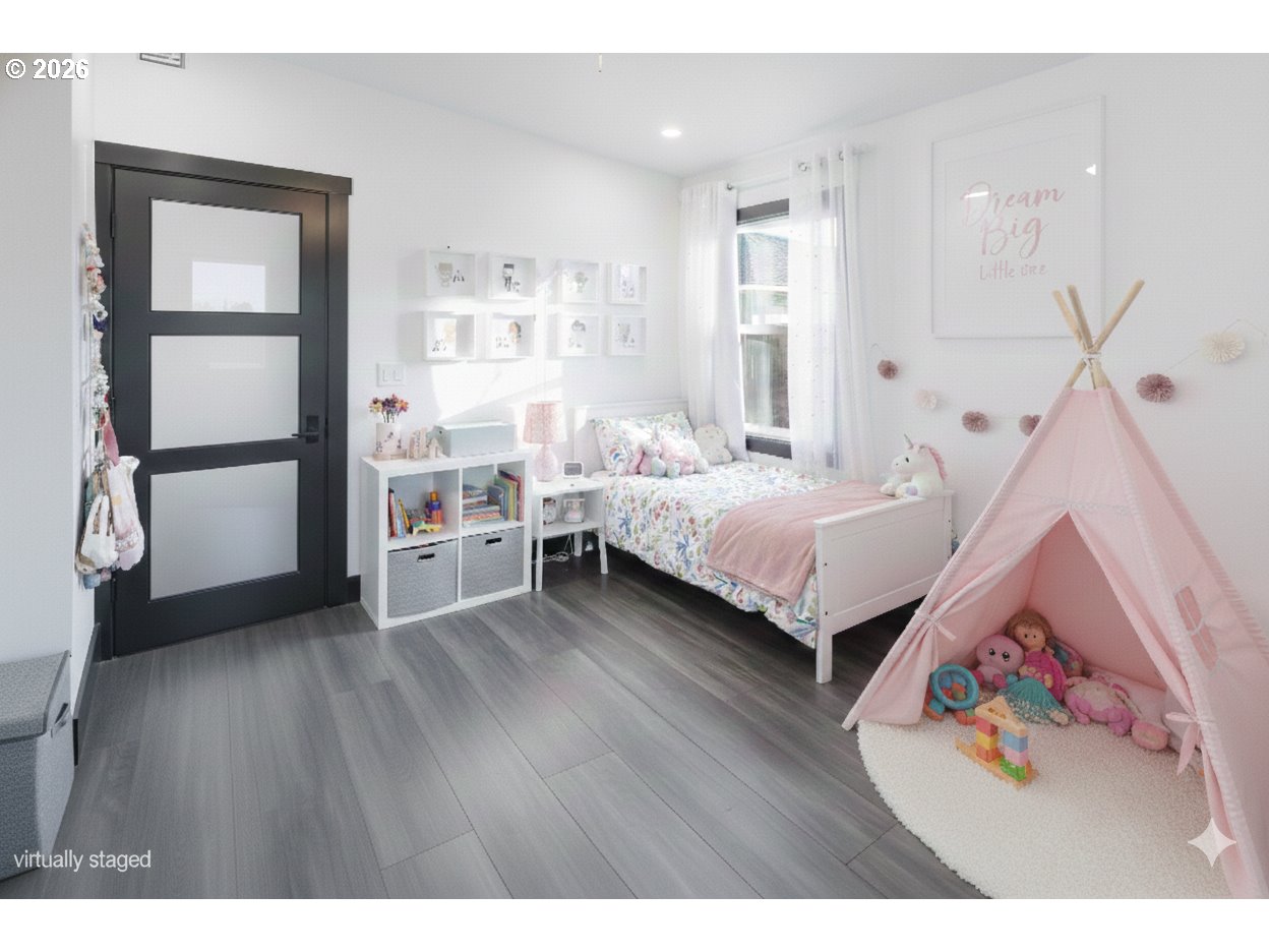 153 Southeast James Street Camas, WA 98607 - Photo 21 of 35 a bedroom with a bed and a window