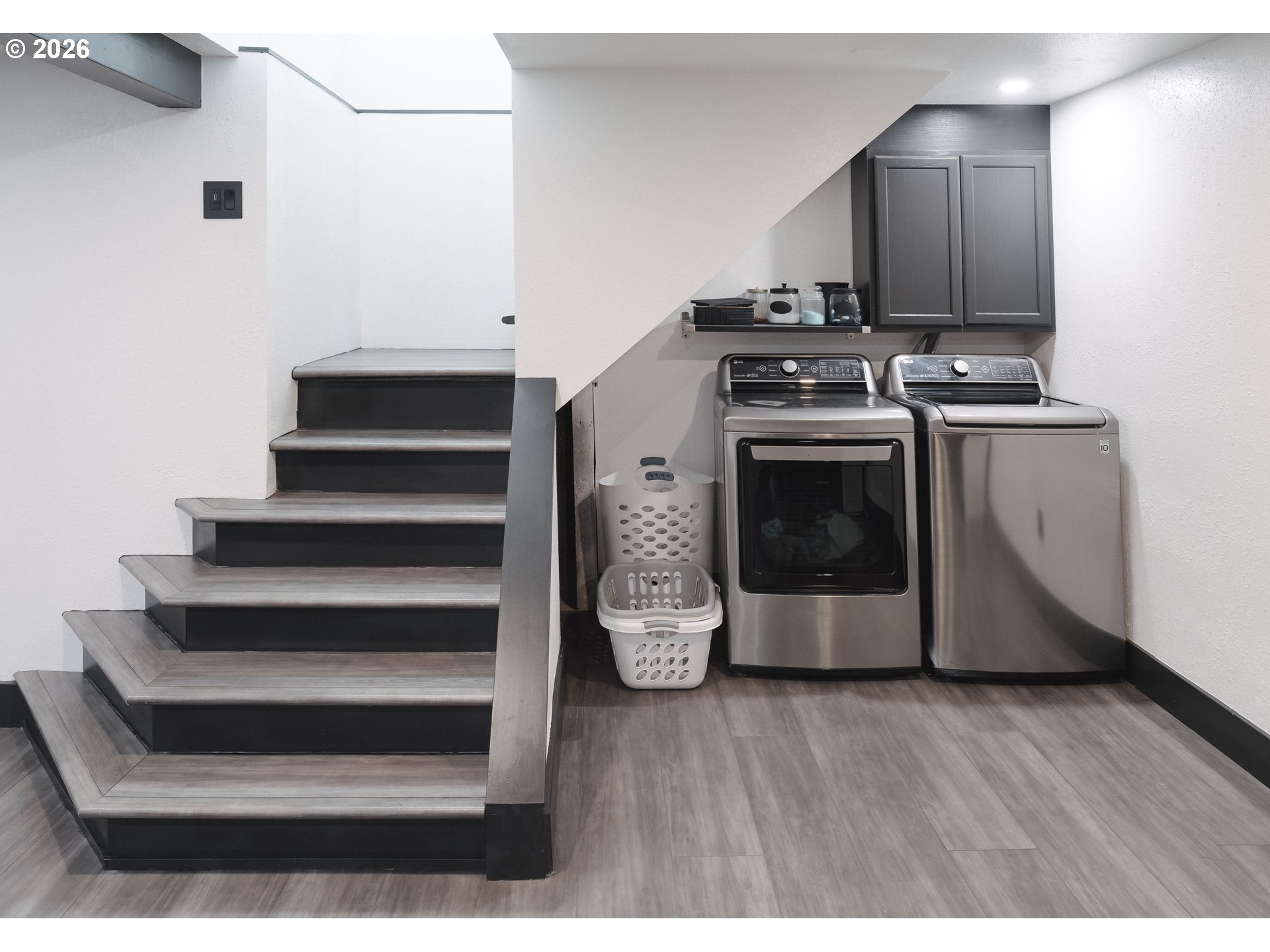153 Southeast James Street Camas, WA 98607 - Photo 24 of 35 a kitchen with granite countertop a stove and a wooden floor