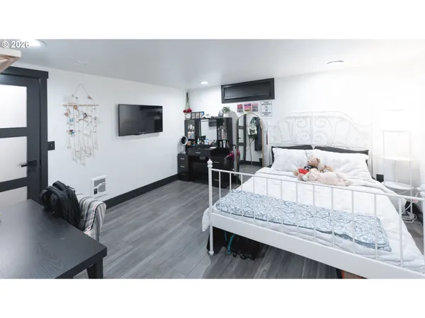 a bedroom with a bed and a table in it