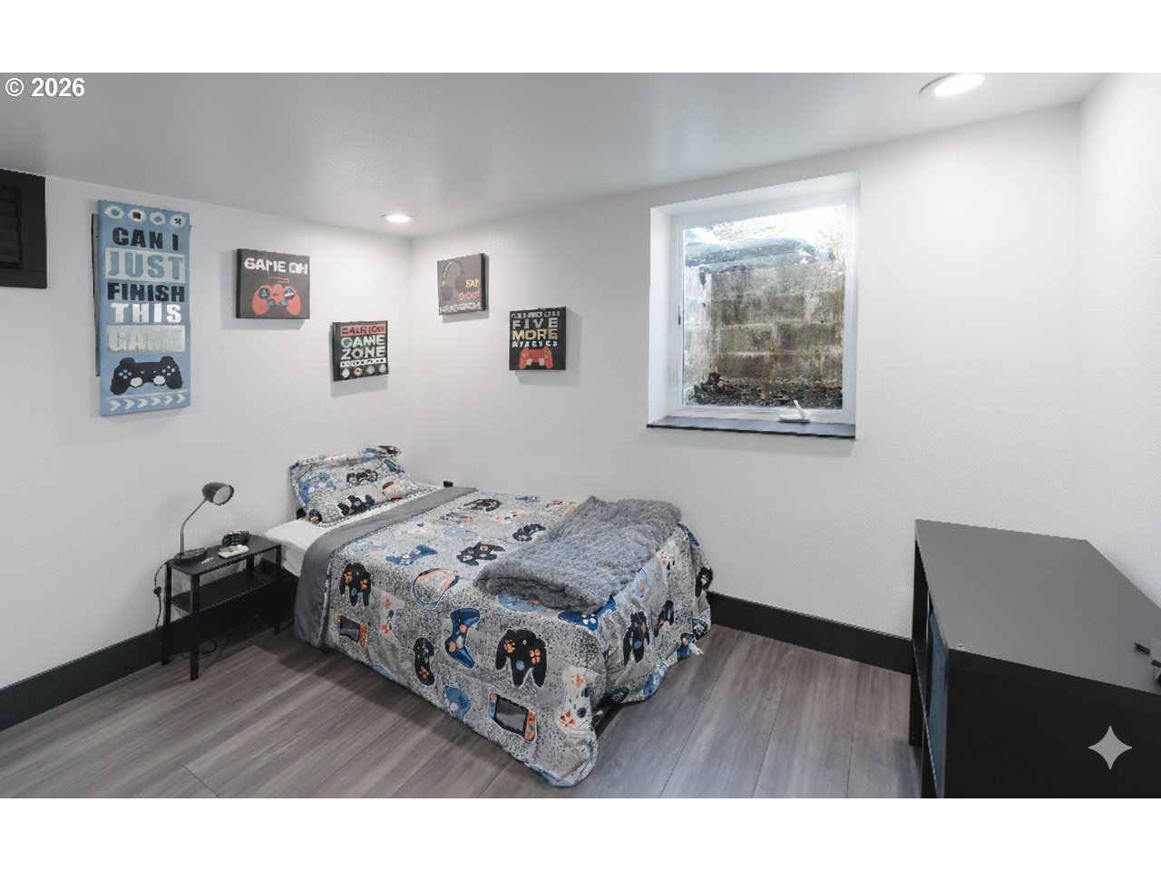 153 Southeast James Street Camas, WA 98607 - Photo 31 of 35 a bedroom with a bed and a table in it