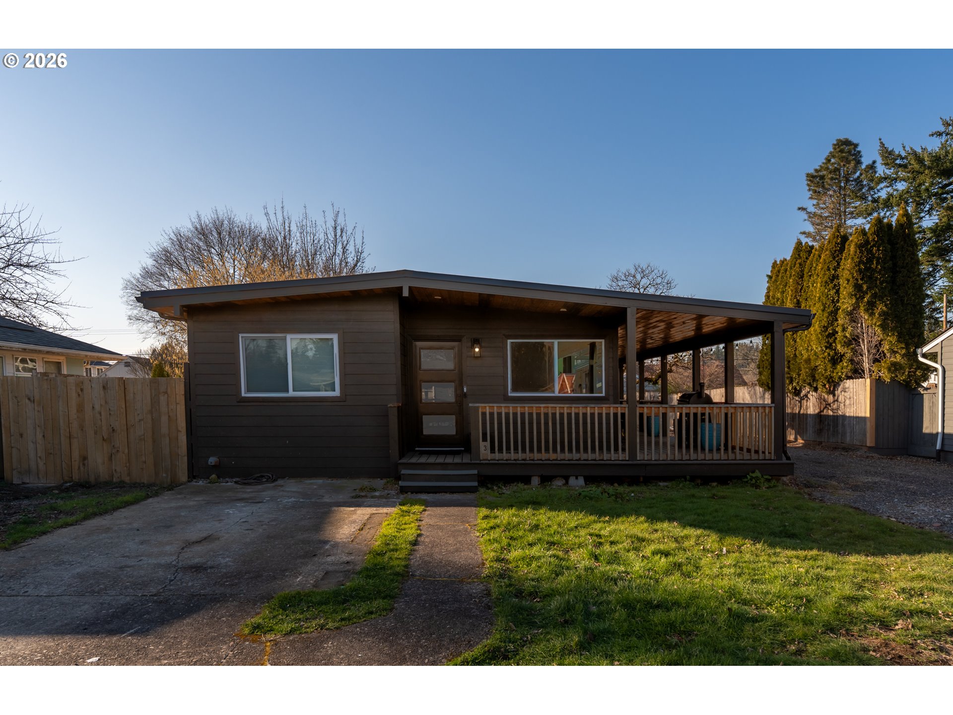 153 Southeast James Street Camas, WA 98607 - Photo 5 of 35 a front view of a house with a yard