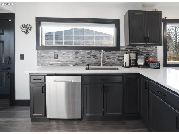 a kitchen with a sink and cabinets