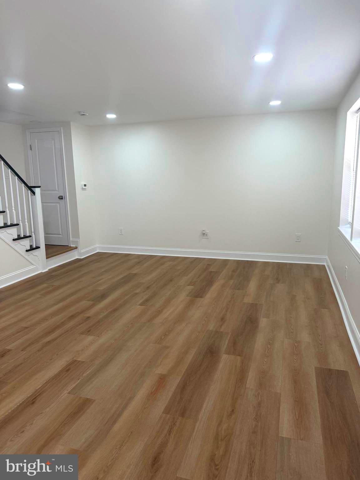 306 Brentwood Road Havertown, PA 19083 - Photo 11 of 48 an empty room with wooden floor and windows