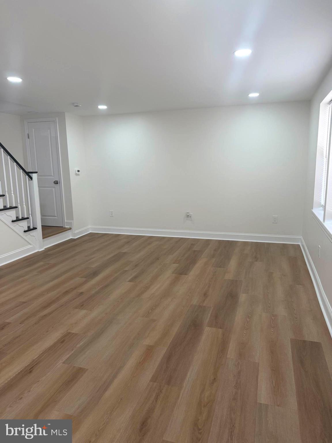 306 Brentwood Road Havertown, PA 19083 - Photo 17 of 48 an empty room with wooden floor and windows