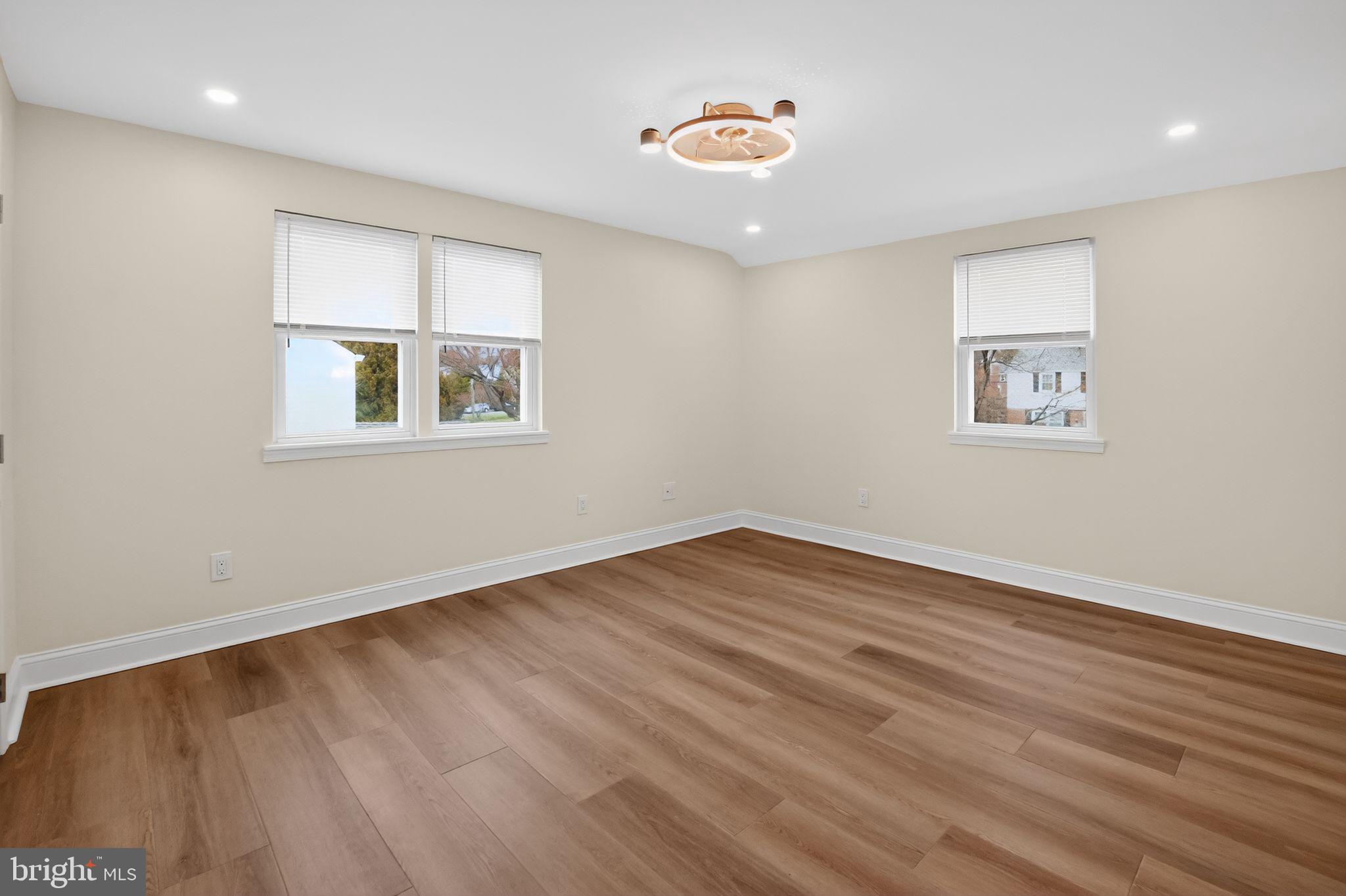 306 Brentwood Road Havertown, PA 19083 - Photo 24 of 48 a view of an empty room with wooden floor and a window
