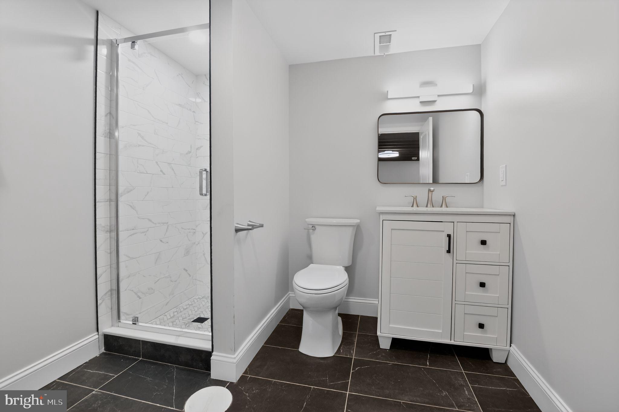 306 Brentwood Road Havertown, PA 19083 - Photo 25 of 48 a bathroom with a toilet a sink and mirror