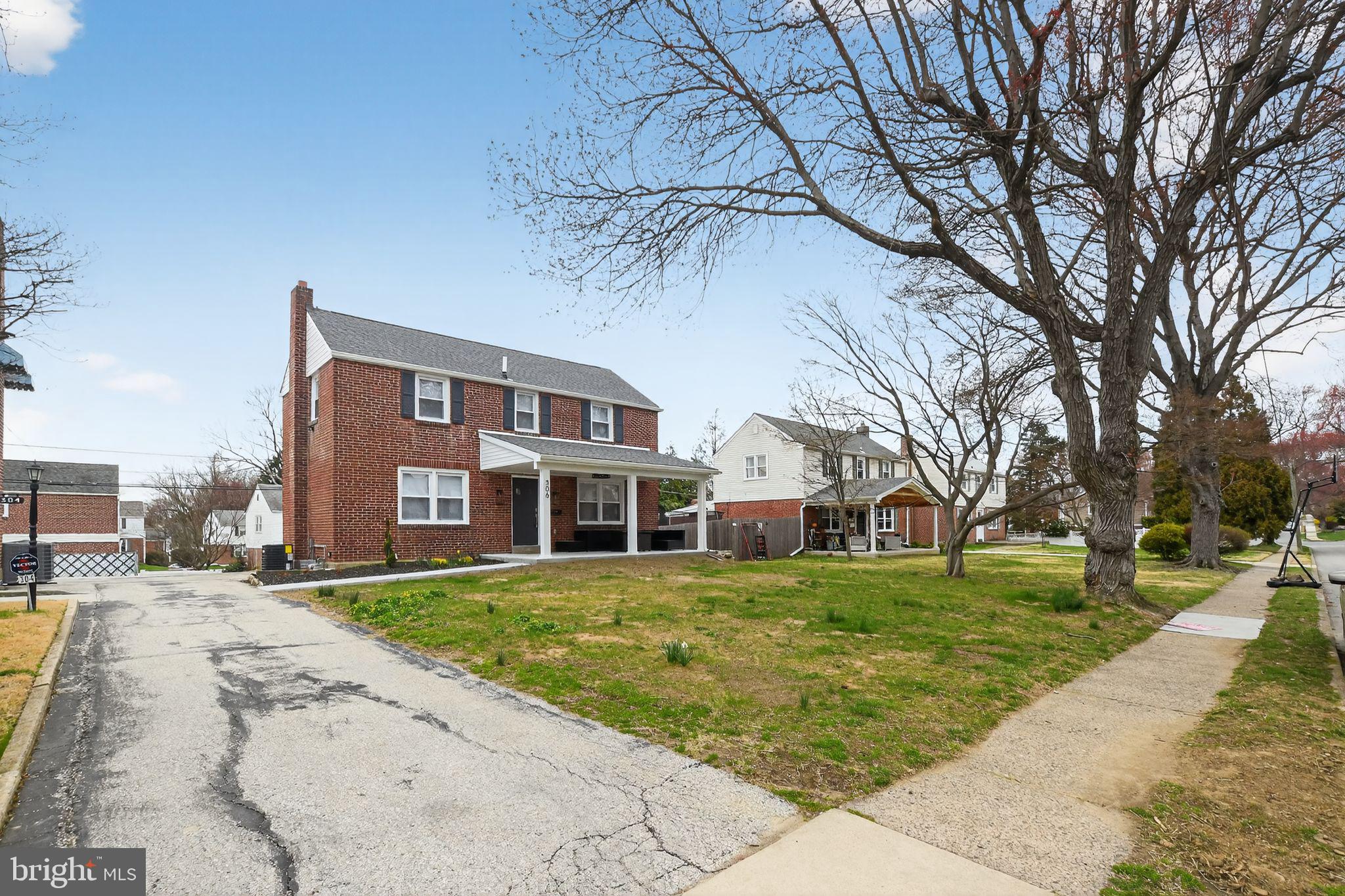 306 Brentwood Road Havertown, PA 19083 - Photo 41 of 48 a view of a building with a yard