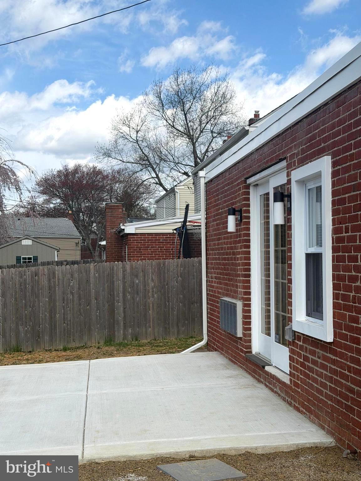 306 Brentwood Road Havertown, PA 19083 - Photo 48 of 48 a view of a brick house with a wooden fence