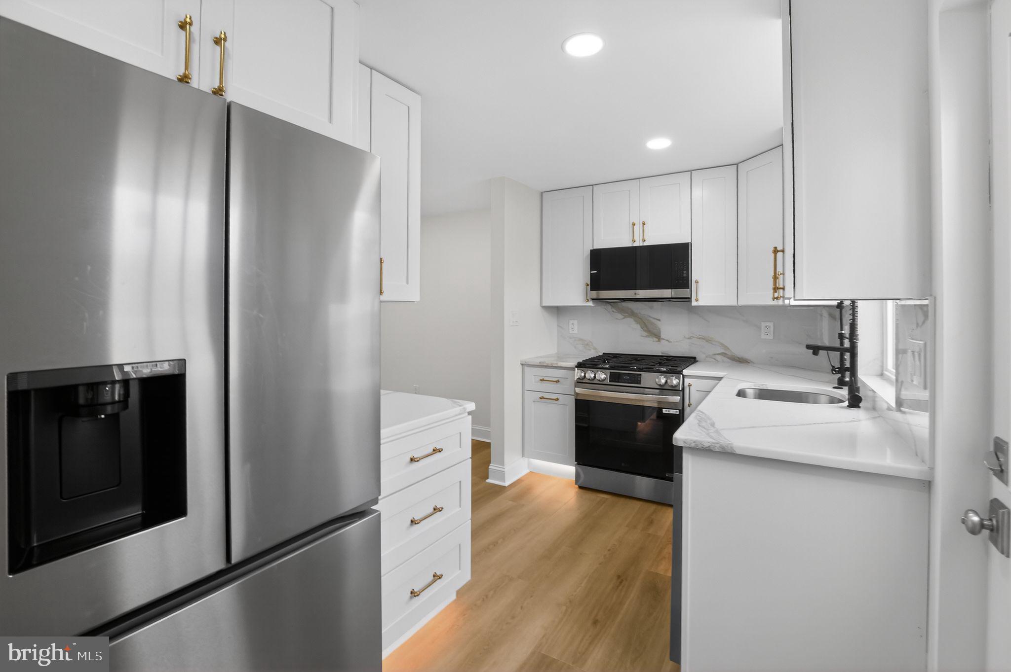 306 Brentwood Road Havertown, PA 19083 - Photo 6 of 48 a kitchen with stainless steel appliances granite countertop a refrigerator stove and sink