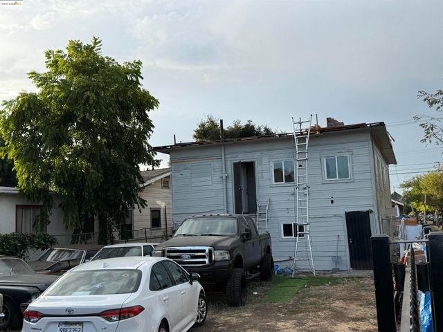 a front view of a house with parking space