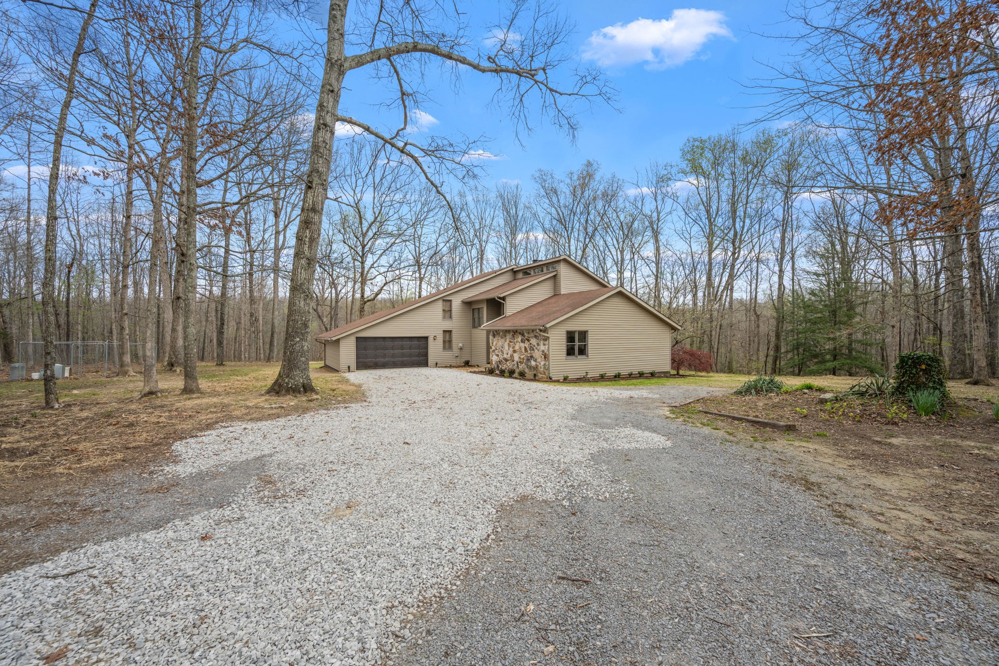 268 Davis Road Wartrace, TN 37183 - Photo 16 of 74 a front view of a house with a yard and garage