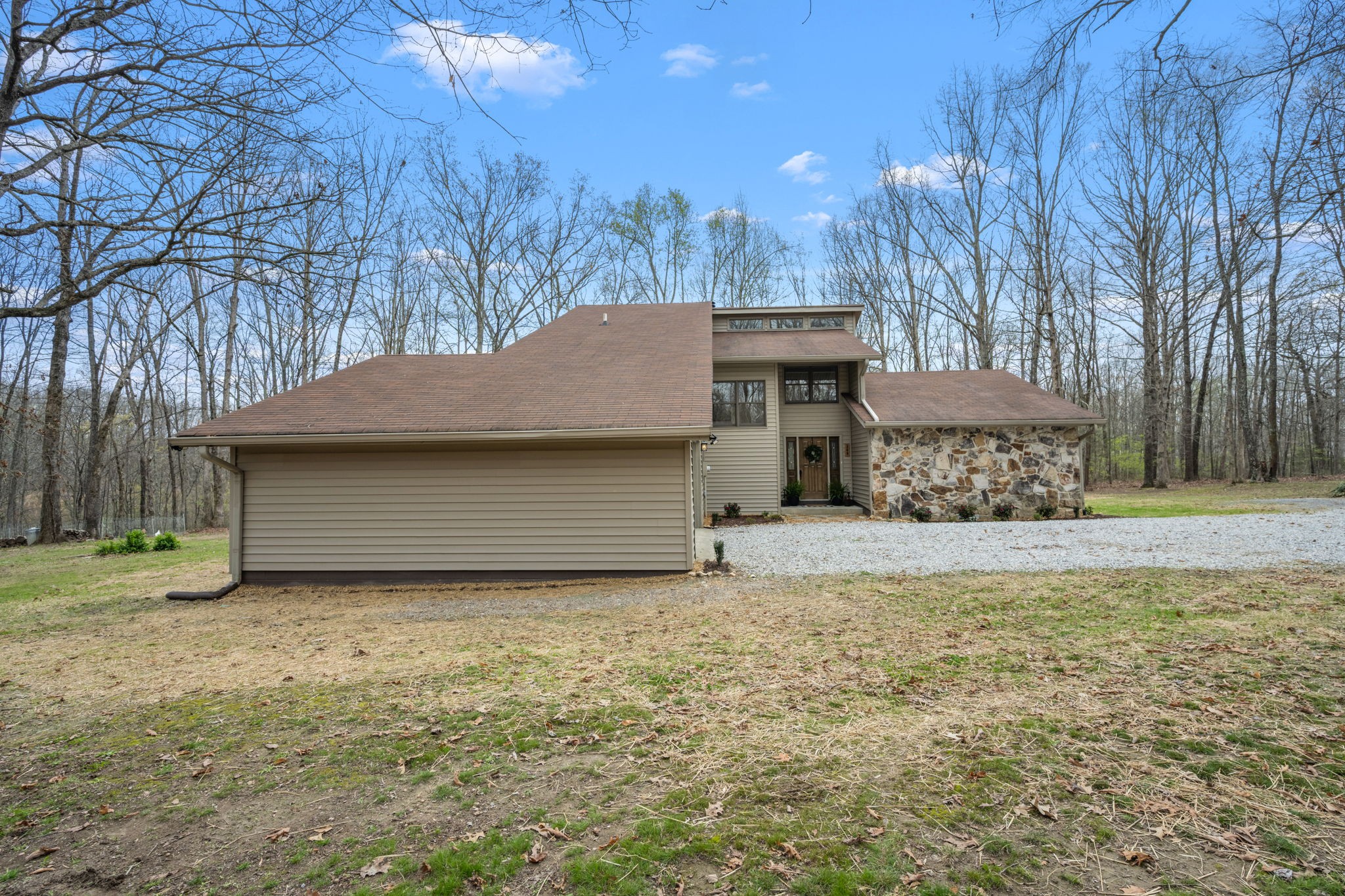 268 Davis Road Wartrace, TN 37183 - Photo 17 of 74 a front view of a house with a garden and tree