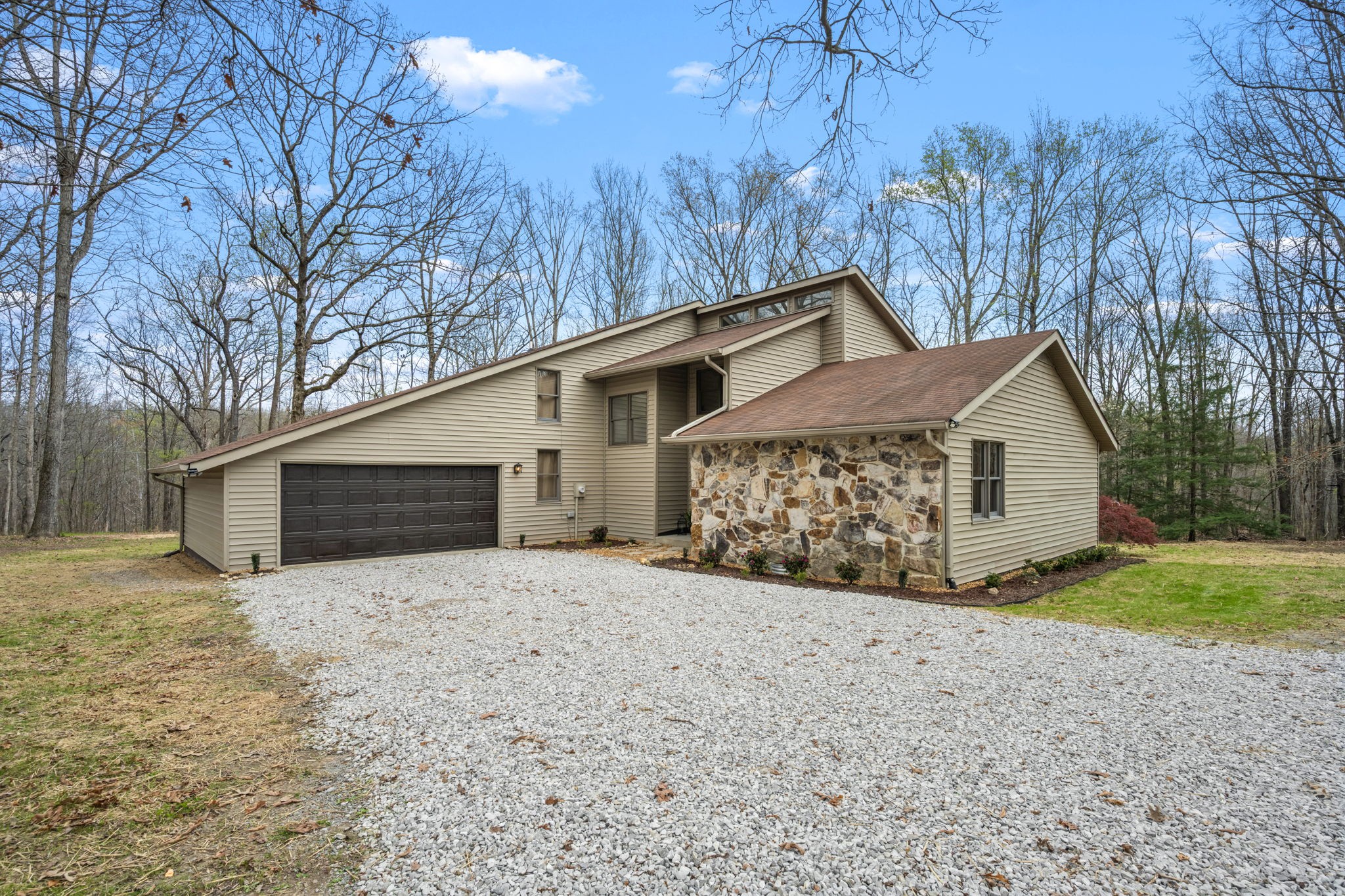 268 Davis Road Wartrace, TN 37183 - Photo 18 of 74 a front view of a house with a yard and garage