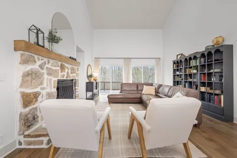 a kitchen with granite countertop white cabinets and stainless steel appliances
