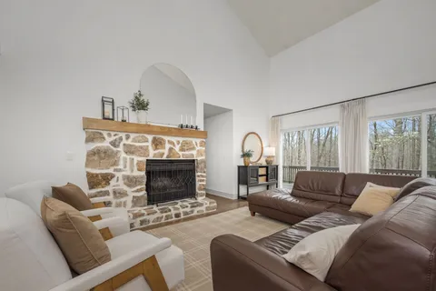 a view of a storage and utility room with washer and dryer