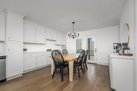 a bedroom with a bed and a table