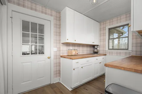 a bedroom with two beds and a large window