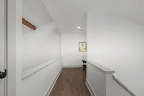 a view of a house with wooden deck