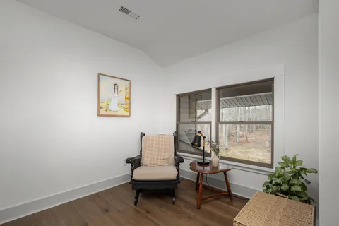 a view of a park with bench and trees