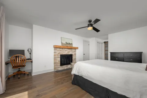 a view of a backyard with wooden fence