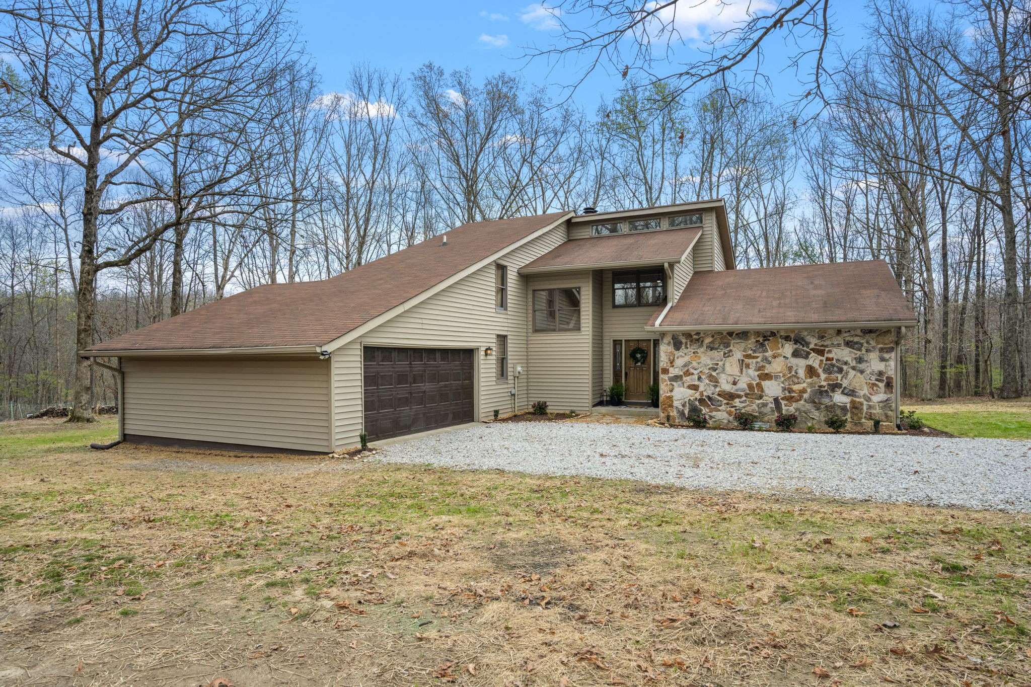 268 Davis Road Wartrace, TN 37183 - Photo 10 of 74 a front view of a house with a yard and garage