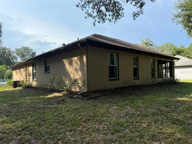 a backyard of a house with lots of green space