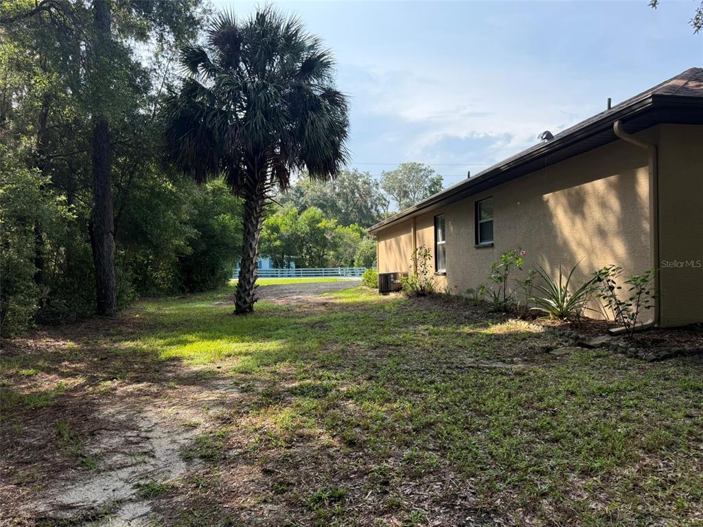 9735 West Dunnellon Road, Unit 31 Crystal River, FL 34428 - Photo 14 of 55 a backyard of a house with lots of green space