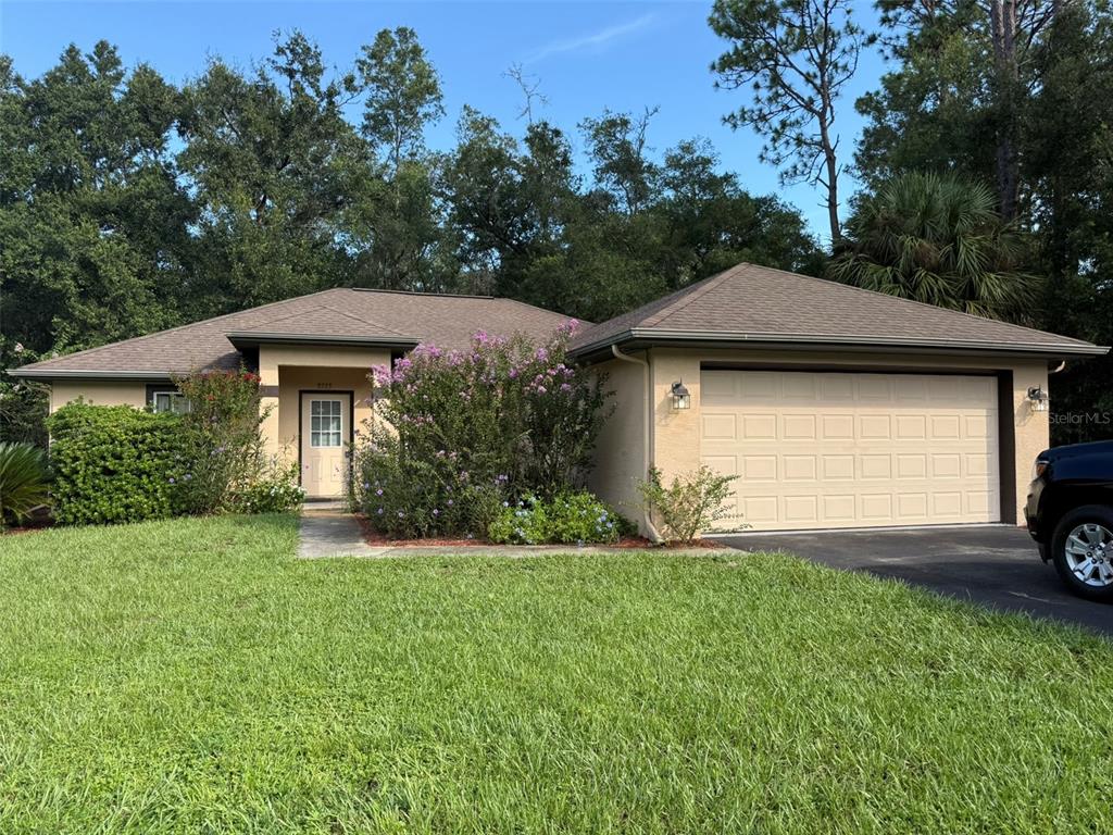 9735 West Dunnellon Road, Unit 31 Crystal River, FL 34428 - Photo 2 of 55 a view of a house with garden and yard