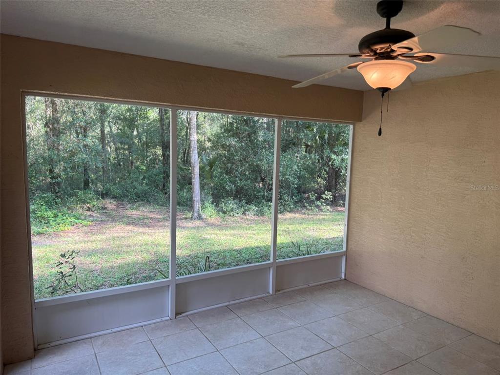 9735 West Dunnellon Road, Unit 31 Crystal River, FL 34428 - Photo 40 of 55 a view of an empty room with a floor to ceiling window