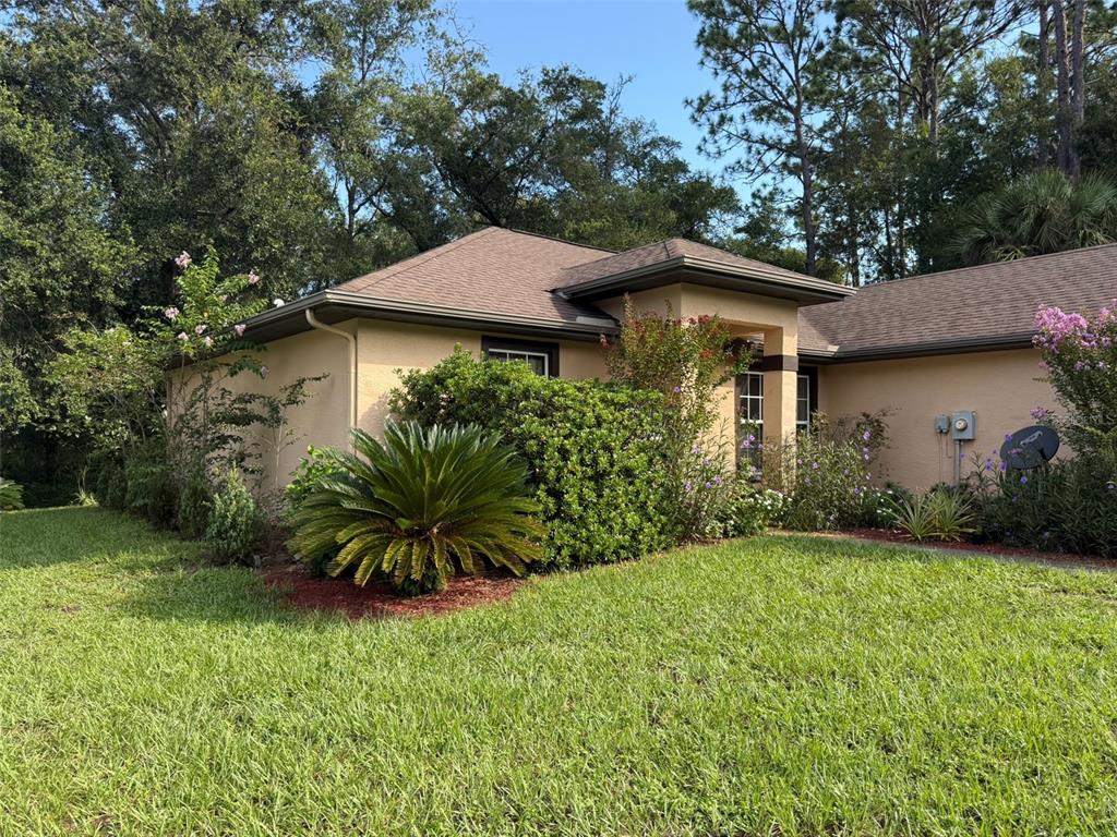 9735 West Dunnellon Road, Unit 31 Crystal River, FL 34428 - Photo 4 of 55 a front view of a house with a garden