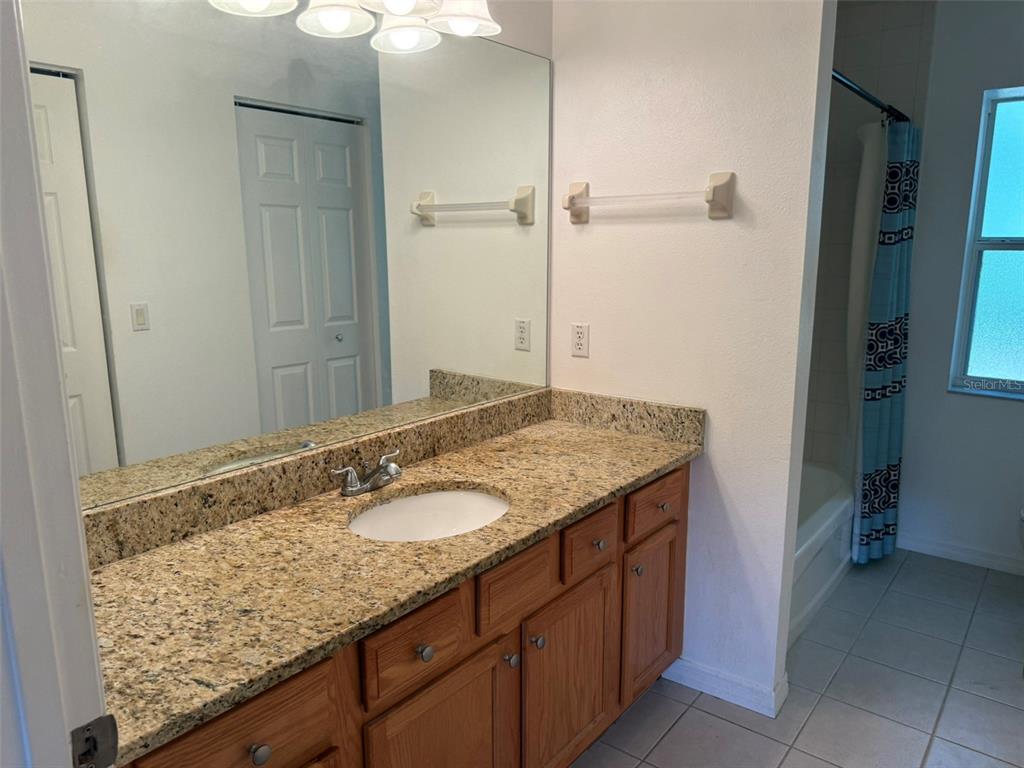 9735 West Dunnellon Road, Unit 31 Crystal River, FL 34428 - Photo 43 of 55 a bathroom with a granite countertop sink and a mirror