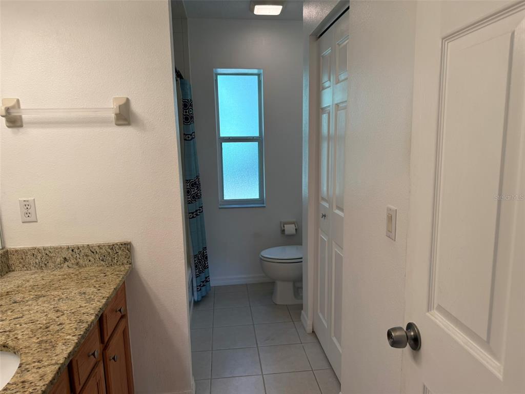 9735 West Dunnellon Road, Unit 31 Crystal River, FL 34428 - Photo 44 of 55 a bathroom with a granite countertop sink and a mirror