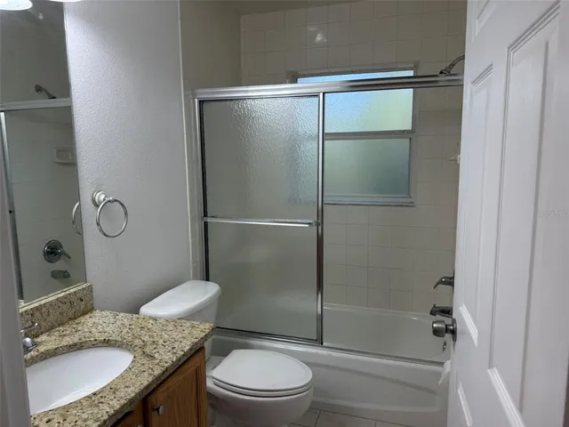 a view of a bathroom from a hallway