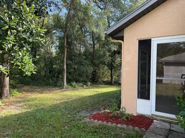 a view of a yard with a tree