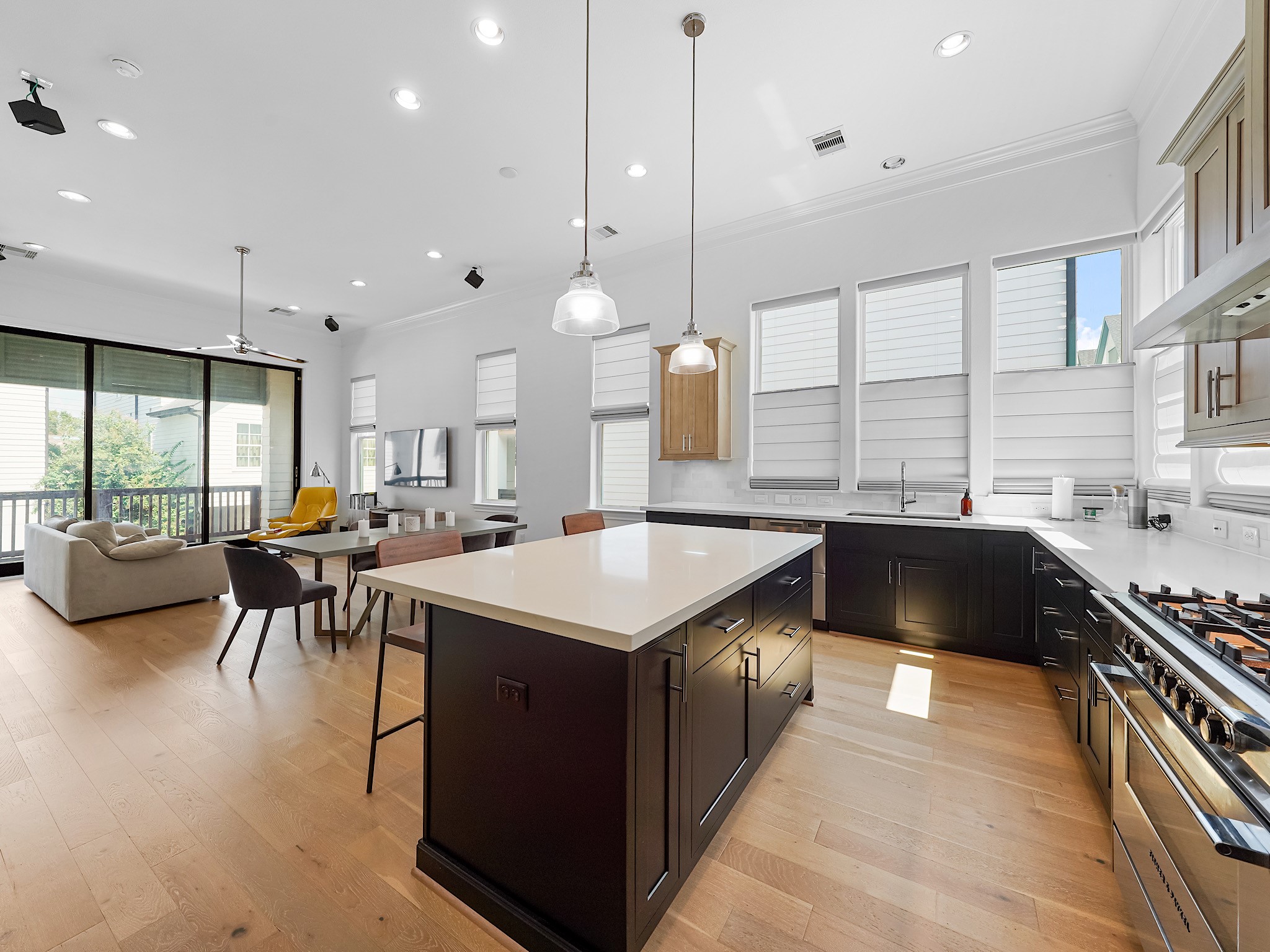 a kitchen with a table chairs stove and cabinets